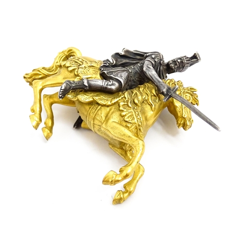 1464 - A late 19th / early 20thC bronze and gilt bronze sculpture modelled as a knight on horseback. Togeth... 