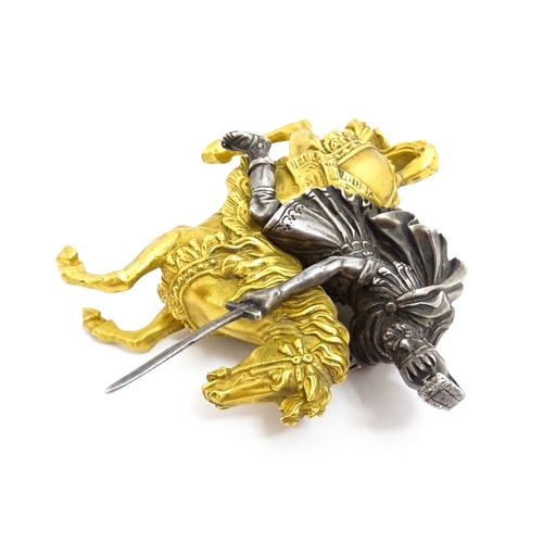 1464 - A late 19th / early 20thC bronze and gilt bronze sculpture modelled as a knight on horseback. Togeth... 