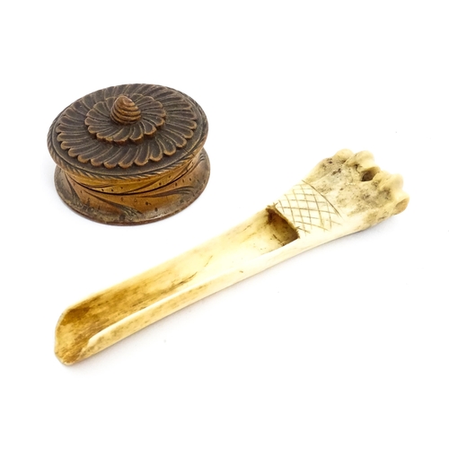 1465 - A 19thC carved knuckle bone apple corer with crosshatched decoration. Together with a treen pot and ... 