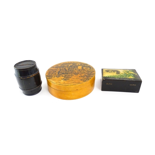 1472 - Two items of 19thC black ground Mauchline ware comprising a money box of barrel form decorated with ... 