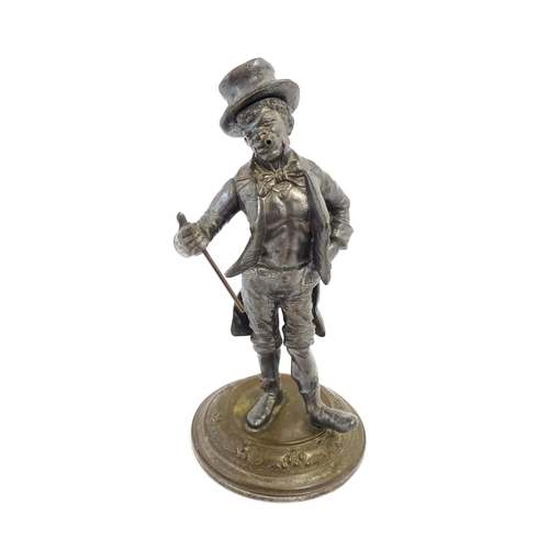 1473 - A late 19th / early 20thC novelty table lighter modelled as a dandy wearing a top hat holding a cane... 