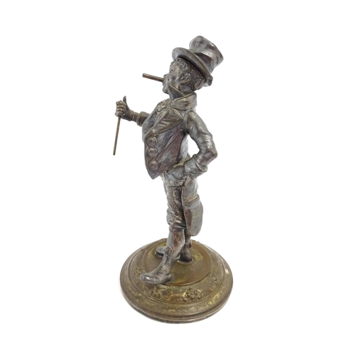 1473 - A late 19th / early 20thC novelty table lighter modelled as a dandy wearing a top hat holding a cane... 