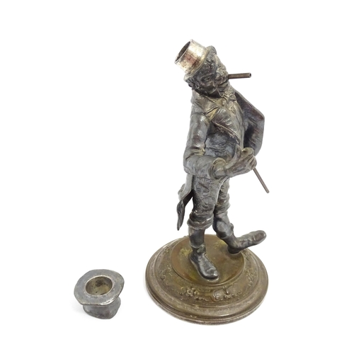 1473 - A late 19th / early 20thC novelty table lighter modelled as a dandy wearing a top hat holding a cane... 