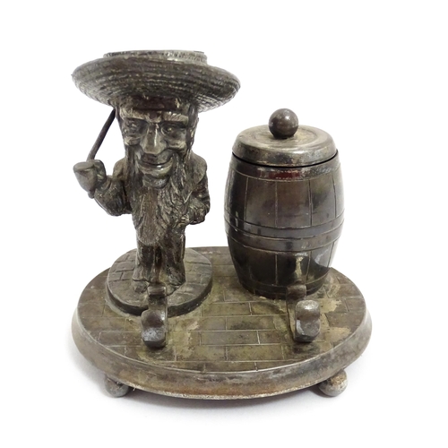 1474 - A 20thC novelty silver plate standish / inkstand comprising inkwell of barrel form, a figural candle... 