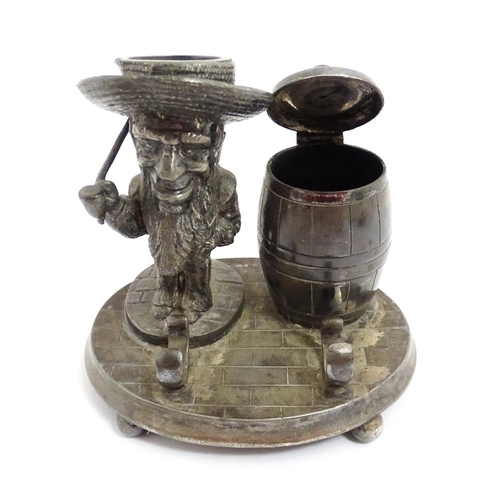 1474 - A 20thC novelty silver plate standish / inkstand comprising inkwell of barrel form, a figural candle... 