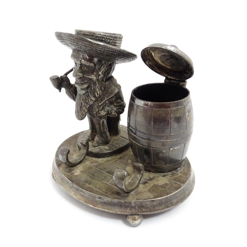 1474 - A 20thC novelty silver plate standish / inkstand comprising inkwell of barrel form, a figural candle... 