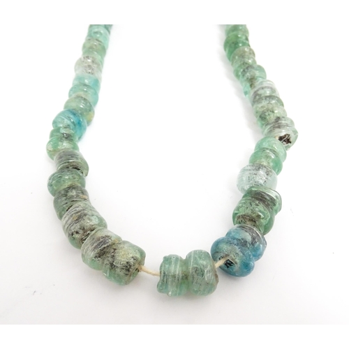 301A - A necklace made of aqua glass beads. Approx. 28