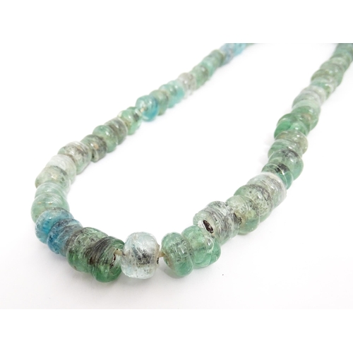 301A - A necklace made of aqua glass beads. Approx. 28