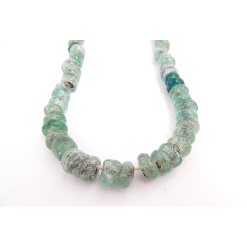 301A - A necklace made of aqua glass beads. Approx. 28