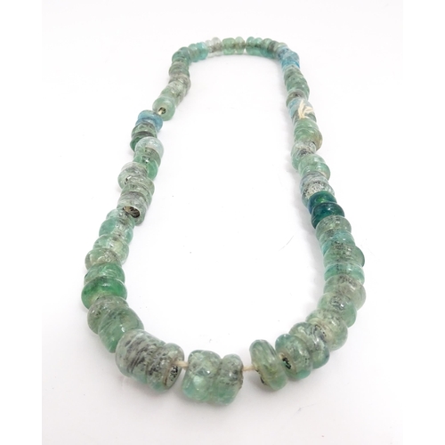 301A - A necklace made of aqua glass beads. Approx. 28