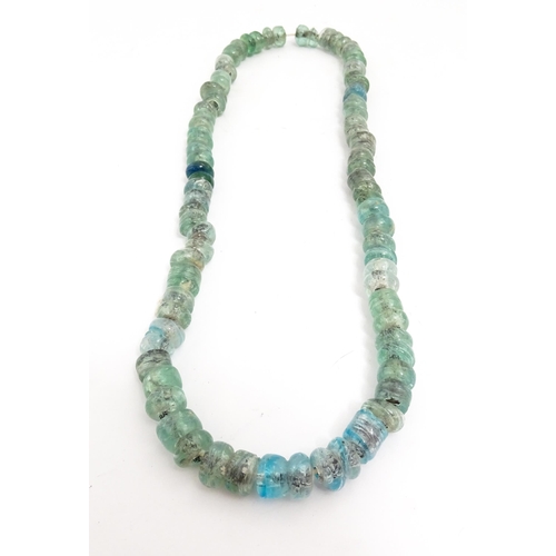 301A - A necklace made of aqua glass beads. Approx. 28