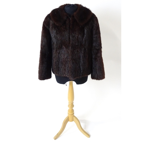 1193 - Vintage fashion / clothing: A short length fur jacket by Femina Furs, London. Chest approx. 34