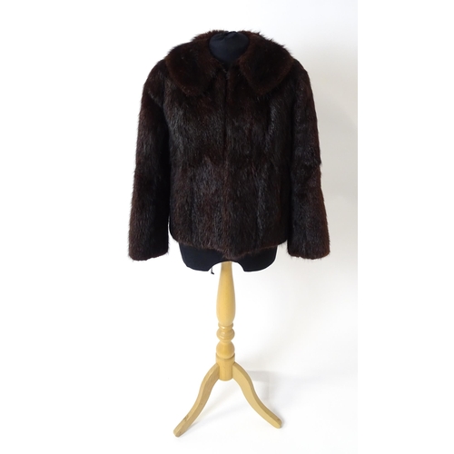 1193 - Vintage fashion / clothing: A short length fur jacket by Femina Furs, London. Chest approx. 34