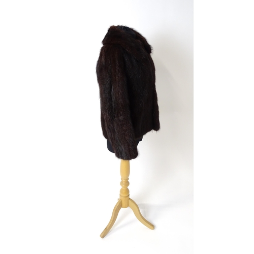 1193 - Vintage fashion / clothing: A short length fur jacket by Femina Furs, London. Chest approx. 34