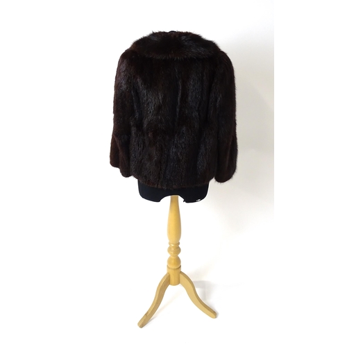 1193 - Vintage fashion / clothing: A short length fur jacket by Femina Furs, London. Chest approx. 34