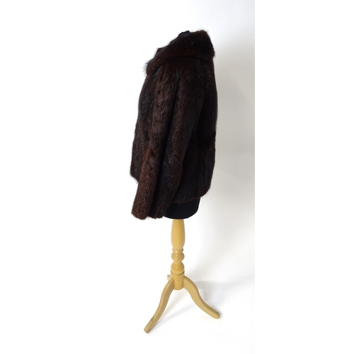 1193 - Vintage fashion / clothing: A short length fur jacket by Femina Furs, London. Chest approx. 34