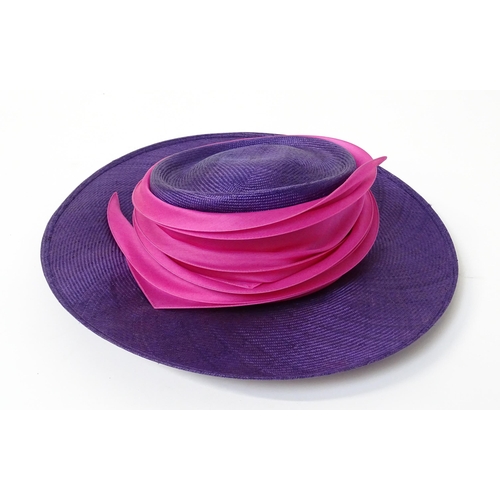 1196 - Vintage fashion / clothing: A Philip Treacy purple wide brim hat with pink swirl banding.