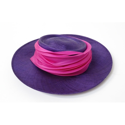 1196 - Vintage fashion / clothing: A Philip Treacy purple wide brim hat with pink swirl banding.