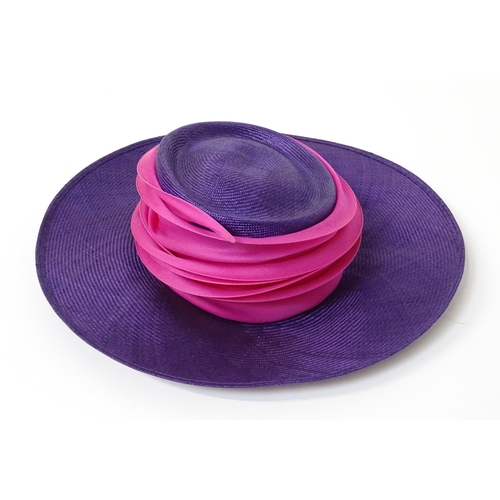 1196 - Vintage fashion / clothing: A Philip Treacy purple wide brim hat with pink swirl banding.