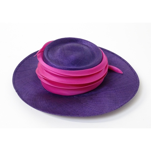 1196 - Vintage fashion / clothing: A Philip Treacy purple wide brim hat with pink swirl banding.