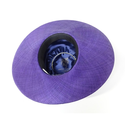 1196 - Vintage fashion / clothing: A Philip Treacy purple wide brim hat with pink swirl banding.