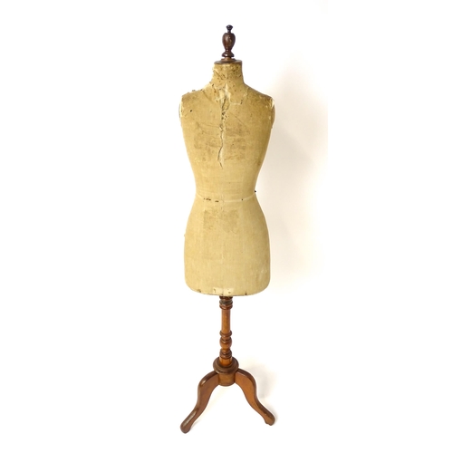 1199 - A tailor's / dressmaker's mannequin, revolving on a turned tripod base, approx 62 1/2