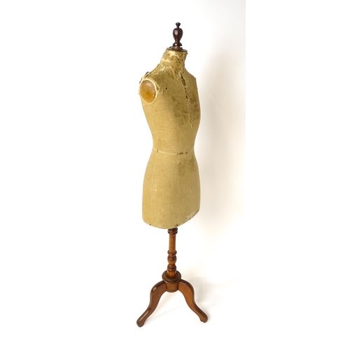 1199 - A tailor's / dressmaker's mannequin, revolving on a turned tripod base, approx 62 1/2