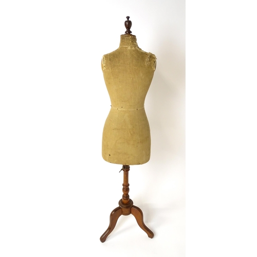 1199 - A tailor's / dressmaker's mannequin, revolving on a turned tripod base, approx 62 1/2