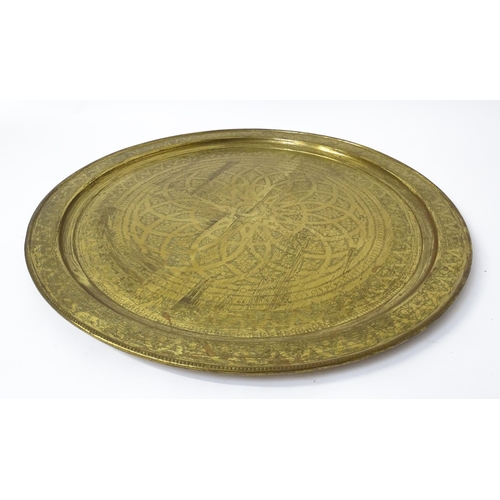 1537 - A large 20thC brass charger / table top with floral and foliate punchwork decoration. Approx. 37 3/4... 