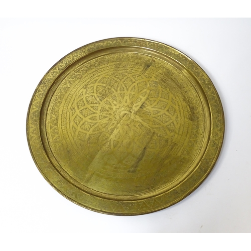 1537 - A large 20thC brass charger / table top with floral and foliate punchwork decoration. Approx. 37 3/4... 