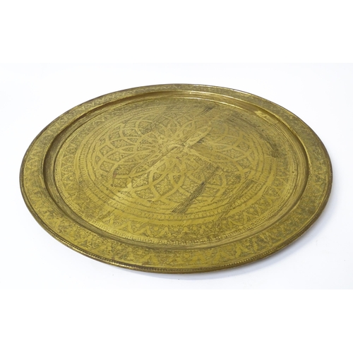 1537 - A large 20thC brass charger / table top with floral and foliate punchwork decoration. Approx. 37 3/4... 