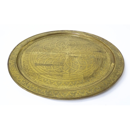 1537 - A large 20thC brass charger / table top with floral and foliate punchwork decoration. Approx. 37 3/4... 