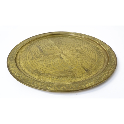 1537 - A large 20thC brass charger / table top with floral and foliate punchwork decoration. Approx. 37 3/4... 