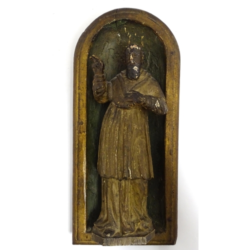 1545 - A late 19th / early 20thC carved wooden plaque depicting Saint Peter in an arched niche. Approx. 14 ... 