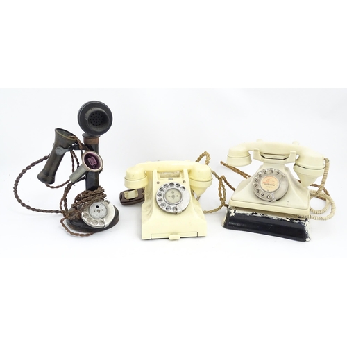 1547 - Four assorted mid 20thC GPO telephones, 
together with a candlestick telephone, the largest approx 1... 