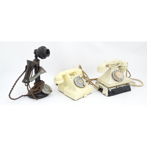 1547 - Four assorted mid 20thC GPO telephones, 
together with a candlestick telephone, the largest approx 1... 