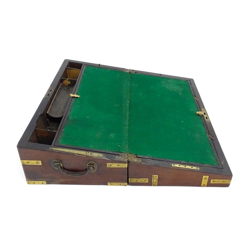 1550 - A 19thC brass bound mahogany writing slope with drawer to one side and having a fitted interior. App... 