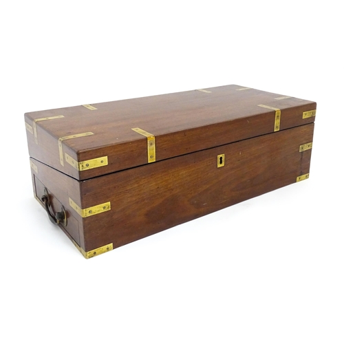 1550 - A 19thC brass bound mahogany writing slope with drawer to one side and having a fitted interior. App... 