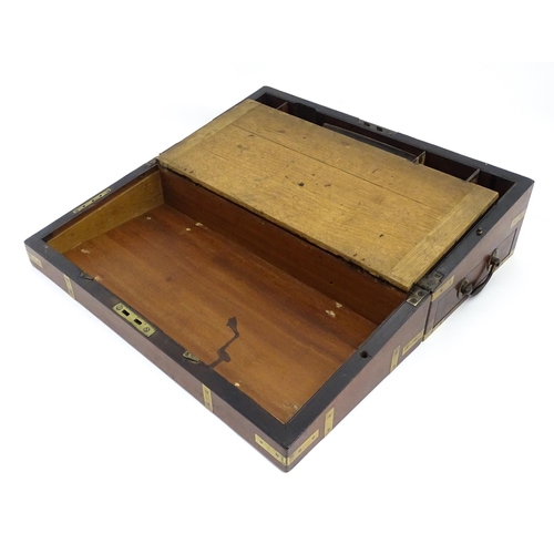 1550 - A 19thC brass bound mahogany writing slope with drawer to one side and having a fitted interior. App... 