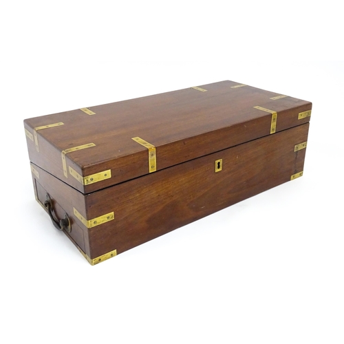 1550 - A 19thC brass bound mahogany writing slope with drawer to one side and having a fitted interior. App... 