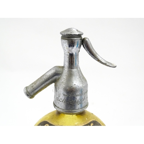 1552 - A mid 20thC amber glass soda siphon with etched Schweppes London emblem , together with an earlier b... 