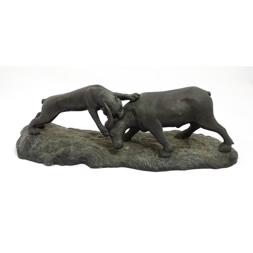 1555 - A Japanese bronze sculpture modelled as a tiger attacking a water buffalo. Approx. 25 1/2