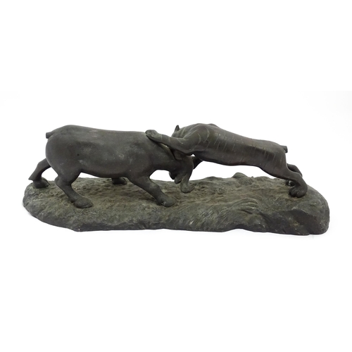 1555 - A Japanese bronze sculpture modelled as a tiger attacking a water buffalo. Approx. 25 1/2