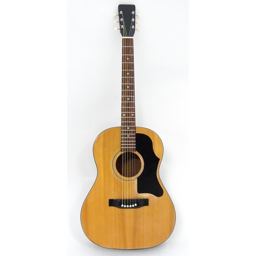 267 - Musical Instrument: a mid to late 20thC B25 style acoustic guitar, the sloped-shoulder grand concert... 