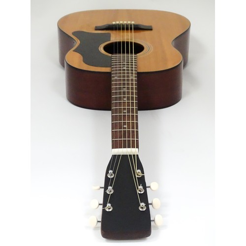 267 - Musical Instrument: a mid to late 20thC B25 style acoustic guitar, the sloped-shoulder grand concert... 