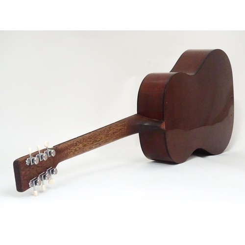 267 - Musical Instrument: a mid to late 20thC B25 style acoustic guitar, the sloped-shoulder grand concert... 