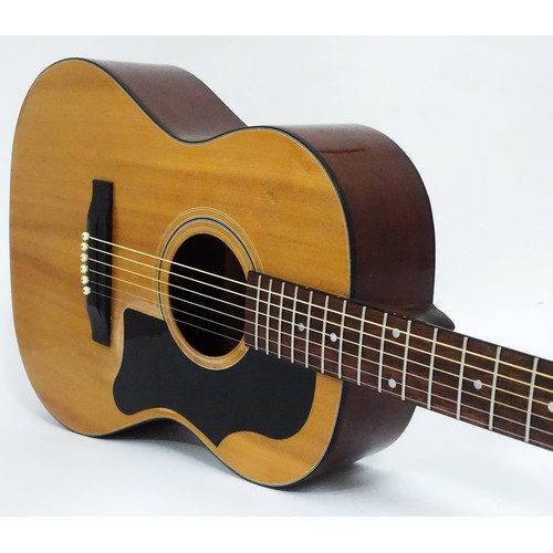 267 - Musical Instrument: a mid to late 20thC B25 style acoustic guitar, the sloped-shoulder grand concert... 