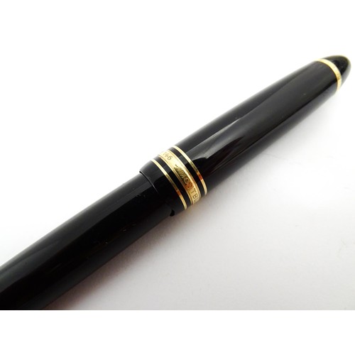 1424 - A cased Montblanc Meisterstuck no. 146 fountain pen, with 14k gold 4810 nib. Approx 5 1/4