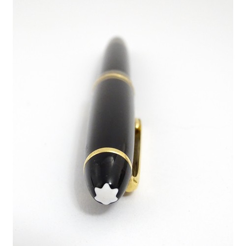 1424 - A cased Montblanc Meisterstuck no. 146 fountain pen, with 14k gold 4810 nib. Approx 5 1/4