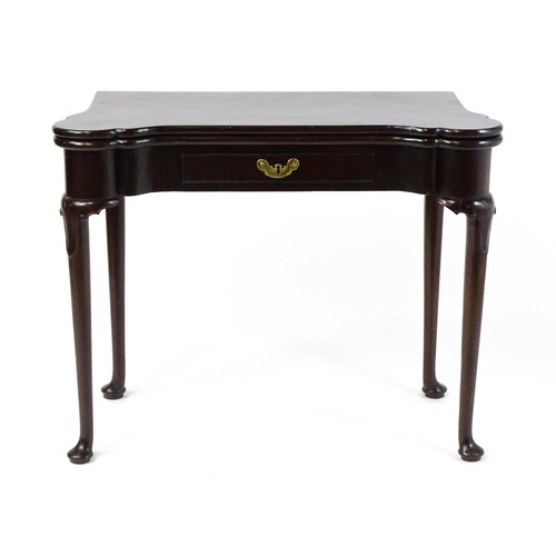 1738 - An 18thC mahogany card table with a castellated hinged top above a single frieze drawer. The table r... 